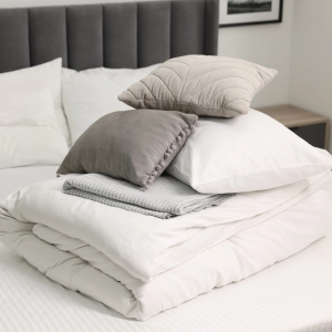 White Folded Bedding On An Semiempty Bed 300X300